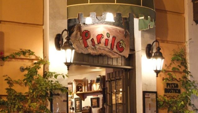 Pirilo Pizza Rustica Escambron Beach Sign